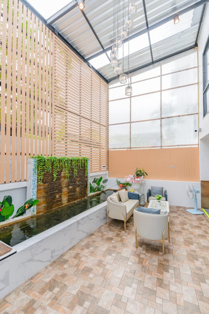 Covered courtyard with the water wall and seating