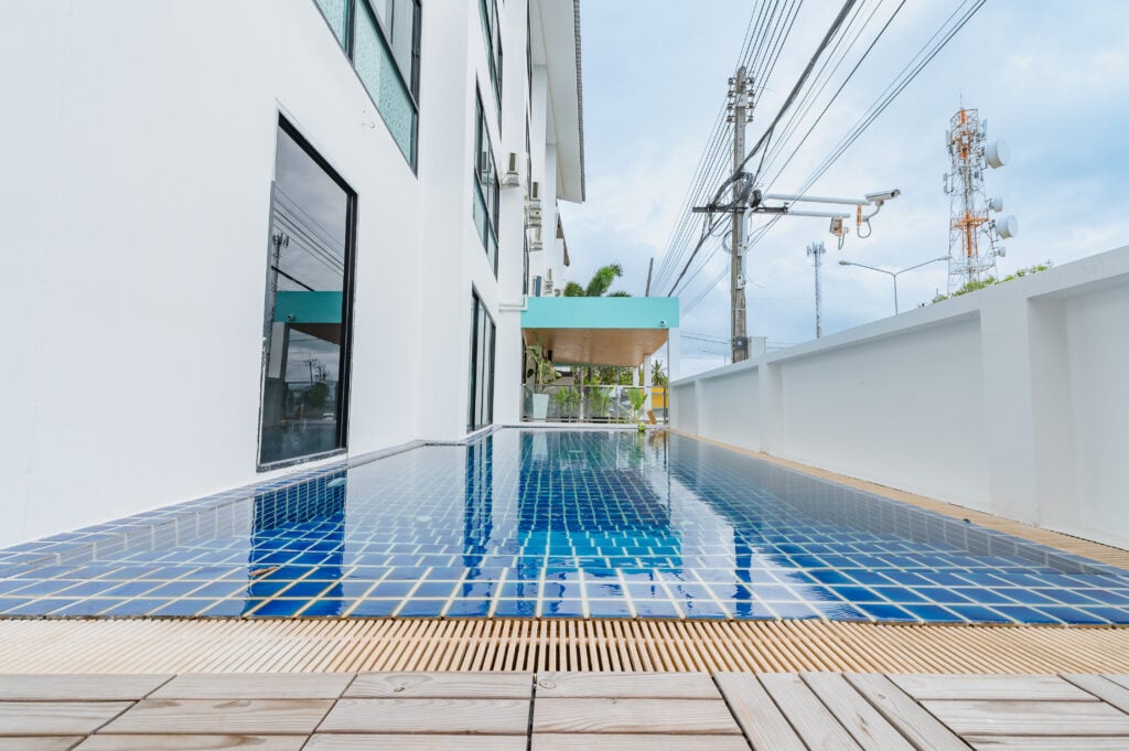 The outdoor swimming pool at De Blue Sea Rawai Hotel
