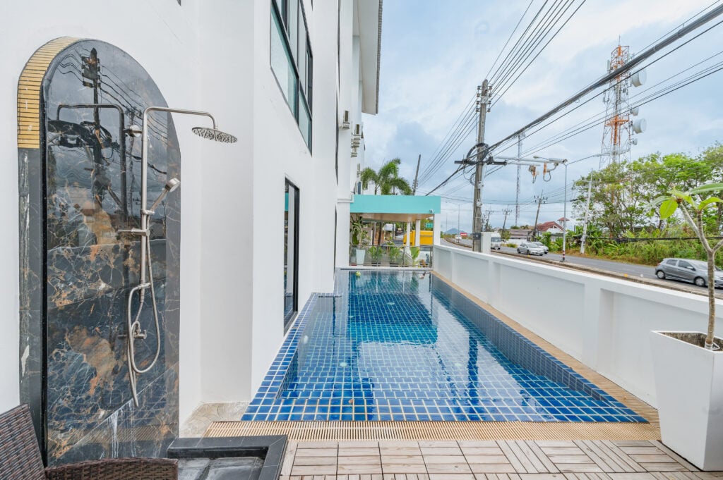 Outdoor rain shower beside the pool